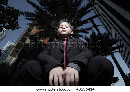 Unusual angle of a child wearing  a business suit