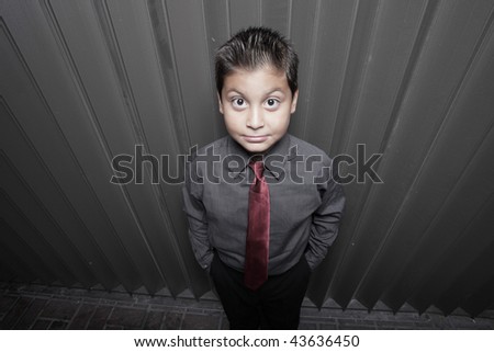 Image of a child in business attire shot from an unusual angle