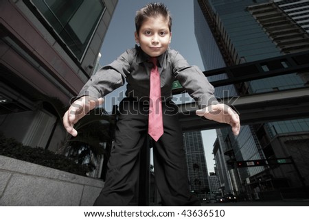 Young boy reaching towards the camera
