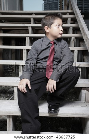 Young businessman sitting on steps