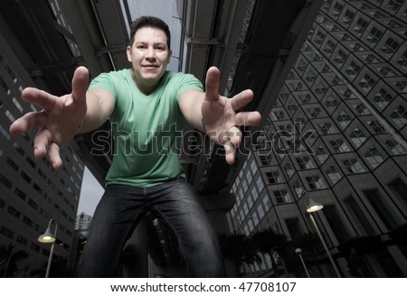 Man reaching downward towards the camera