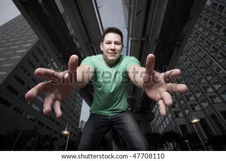 Man reaching downward towards the camera