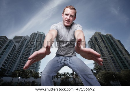 Man reaching down towards the camera