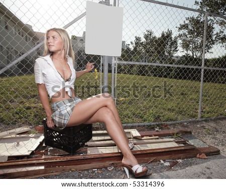 Woman sitting in an urban alley way