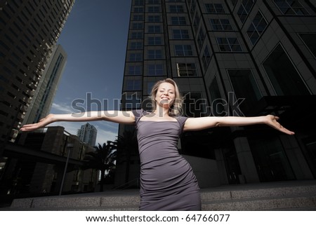 Wide angle image of a woman with arms outstretched
