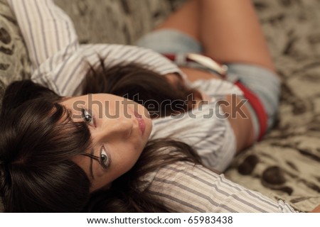 Above angle of a woman laying on the bed