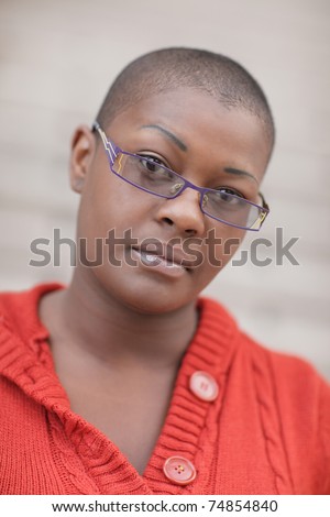 stock photo Young black woman with a shaved head Save to a lightbox 