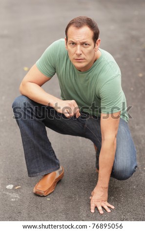 Man in a crouching pose