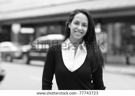 Black and white image of a woman in the city
