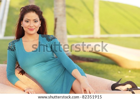 Sexy woman lounging in the park