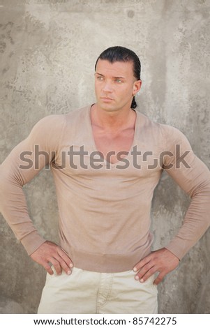 Man posing with hands on his hips