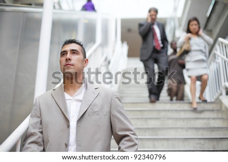 Group of business people walking down the stairs