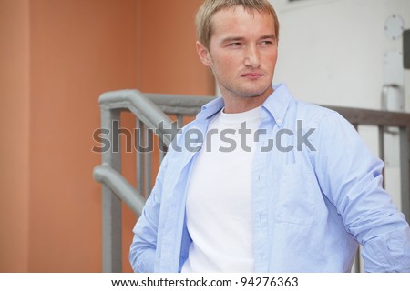 Image of a handsome young Russian model glancing sideways