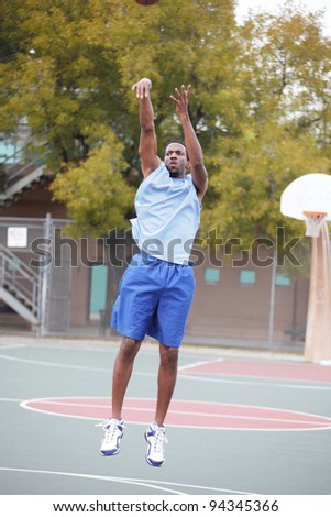 Basketball player throwing the ball