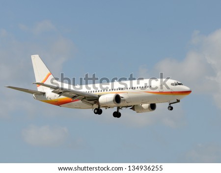Passenger jet airplane landing with gear down