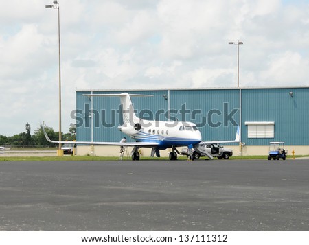 Modern jet airplane used for business charters in maintenance