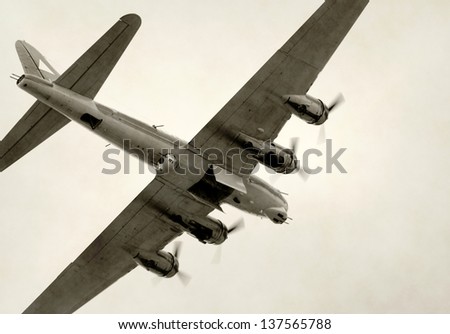 World War II era bomber flying with bomb bay open