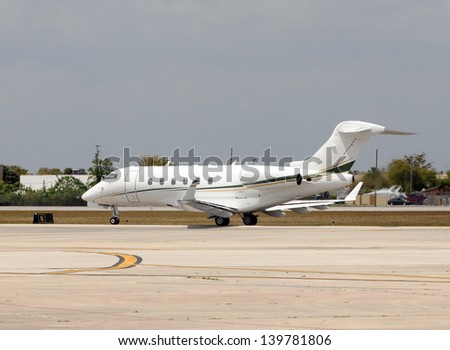 Modern corporate jet airplane preparing for takeoff