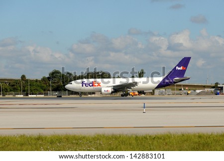 FORT LAUDERDALE - OCTOBER 30: Federal Express cargo jet airplane departs from Fort Lauderdale, Florida on October 30, 2009 to its home base in Memphis, TN