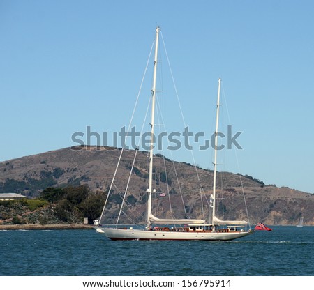 Sailing ship near exotic island side view