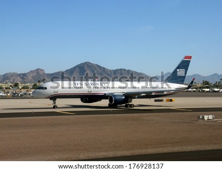 PHOENIX  - SEPTEMBER 29: US Airways Boeing 757 passenger jet arrives in its home base of Phoenix, Arizona after a flight from New York on September 29, 2013