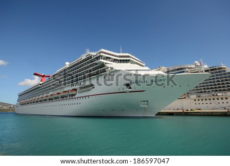 ST. THOMAS - MARCH 26: Carnival Glory cruise ship arrives in St Thomas, US Virgin Islands. on March 26, 2014 The island is one of the most popular destinations in the Caribbean.
