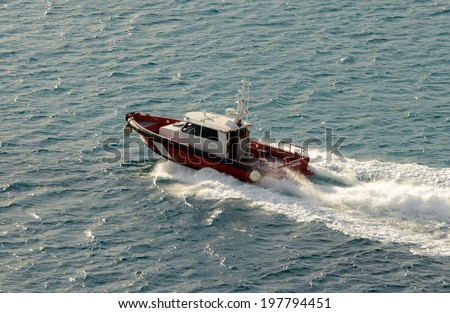 Pilot boats goes out of port to meet inbound ship
