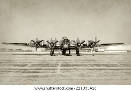 World War II era heavy bomber front view stained old photo