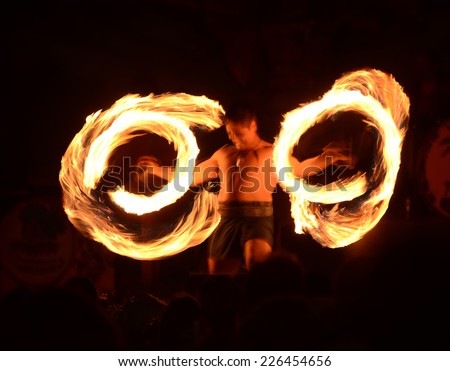 LAHAINA - MARCH 22: Polynesian dancer demonstrates fire dancing during outdoors cultural activities on March 22, 2013 in Lahaina, Hawaii
