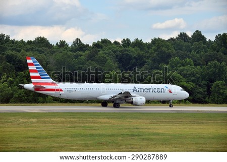 CHARLOTTE - JUNE12: American Airlines Airbus A321 jet departs from Charlotte, NC on June 12, 2015. American has added a number of new 321 jets for coast to coast travel routes