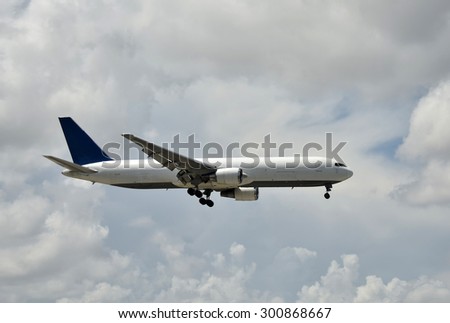 Cargo jet airplane in flight side view