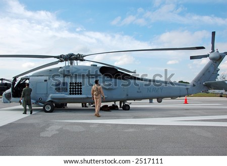 Crew preparing Navy Sikorsky Sea Hawk helicopter for flight