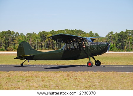 Vintage dark green colored Cessna airplane