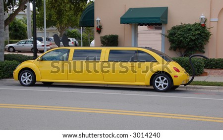 Yellow limousine in the shape of a bug