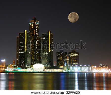 City skyline under moonlight
