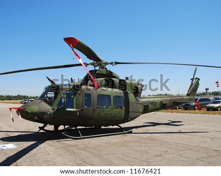 Canadian Air Force helicopter parked on the ground