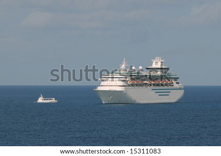 Tender boat transporting passengers to cruise ship