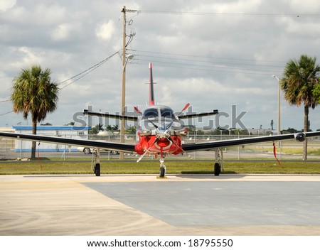 Front view of modern turboprop airplane on the ground