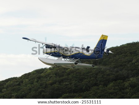 Modern flying boat departing into the morning sky