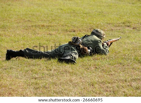 World War II era soldier lying on the ground
