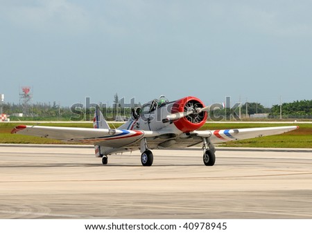 World War II era propeller airplane taxiing