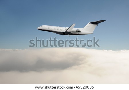 Private jet airplane soaring over the clouds