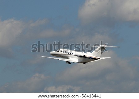 Luxury private jet departing on a business trip