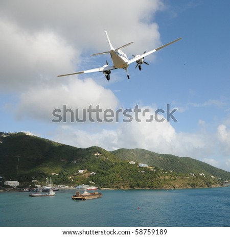 Light charter plane landing on a Caribbean island
