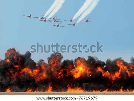 Team of jetfighters dropping bombs with fire and smoke