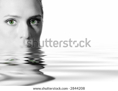 Black & White glamor portrait model with green eyes in water