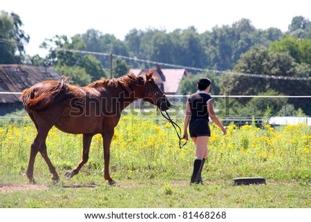Woman walking with horse