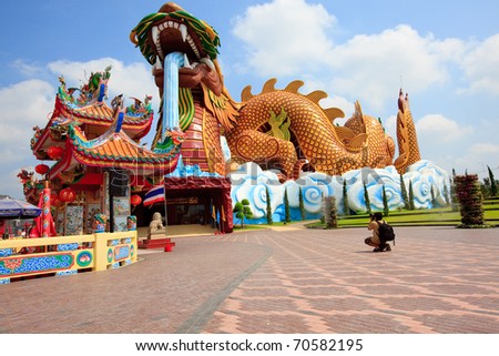 Big Crouching Dragon Statue with Entrance of City of Pillar Shrine in Suphanburi, Thailand