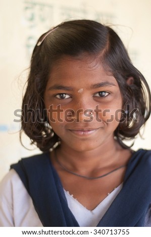 ALANGAON, MAHARASHTRA, INDIA - February 22, 2014: Happy Indian rural girl poses at school, Alangaon, Amravati , Maharashtra, India