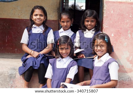 ALANGAON, MAHARASHTRA, INDIA - February 22, 2014: Happy Indian rural girl at their school, Alangaon, Amravati , Maharashtra, India